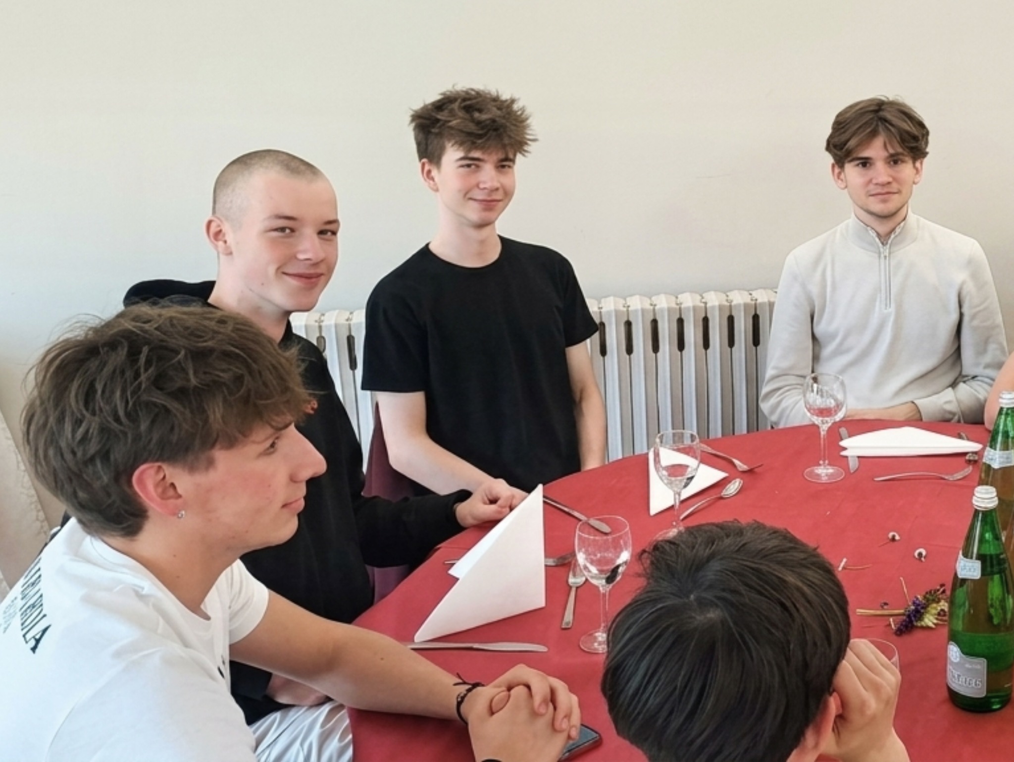 Students gathered around a table during the exchange
