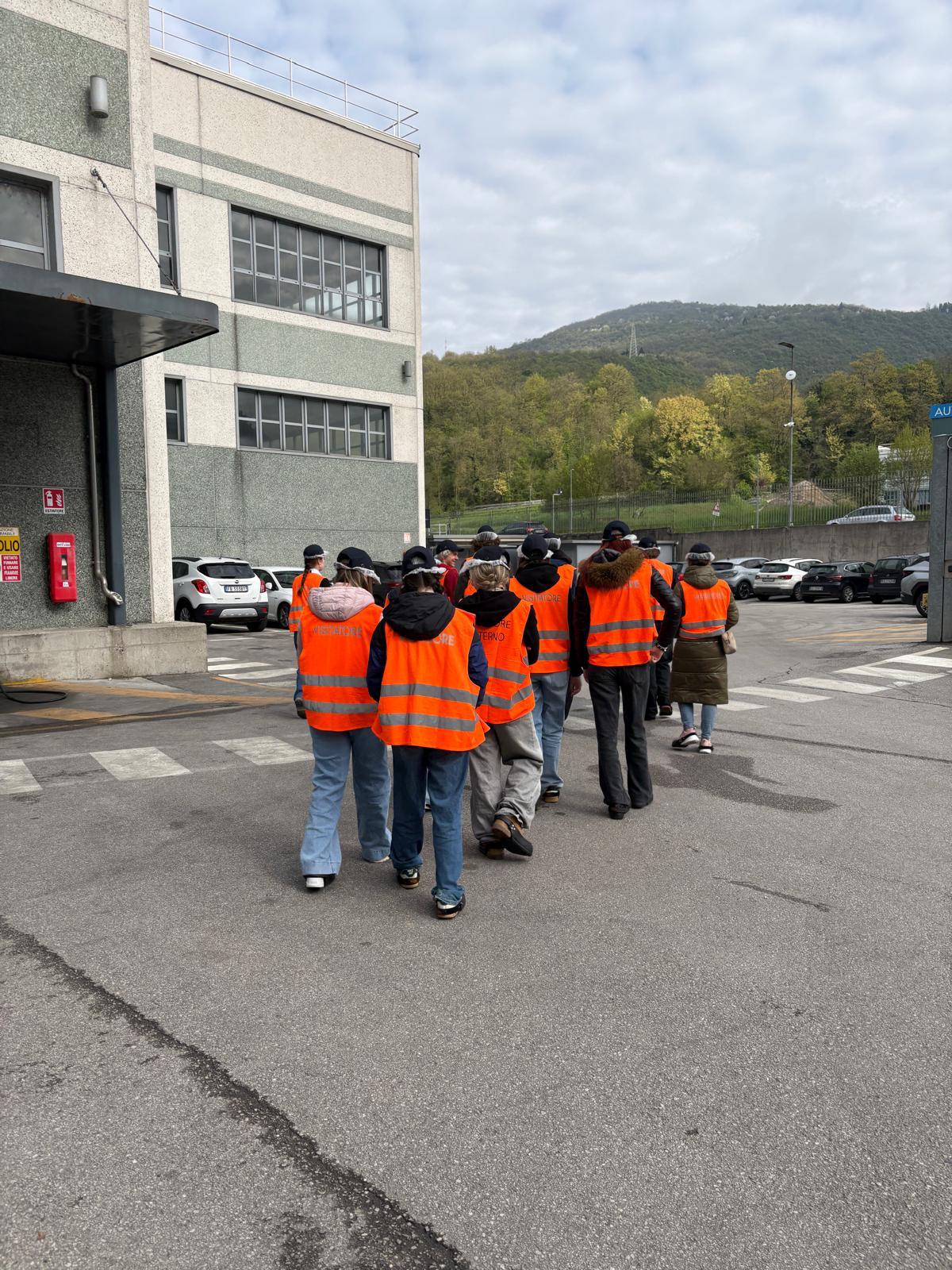 Students in safety vests on an industry visit